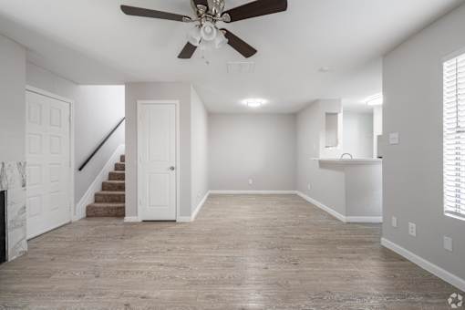 Empty room with ceiling fan at Brook Meadow Village, Austin, TX