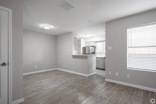 Large empty room at Brook Meadow Village, Austin, TX, 78758