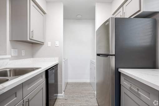 Refrigerator in kitchen at Brook Meadow Village, Austin, 78758