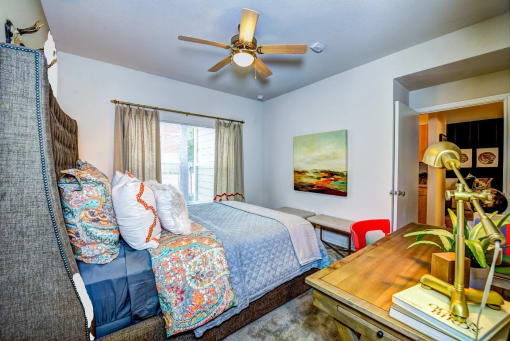a bedroom with a bed and a ceiling fan at Villa Espada Apartments, San Antonio, TX, 78221