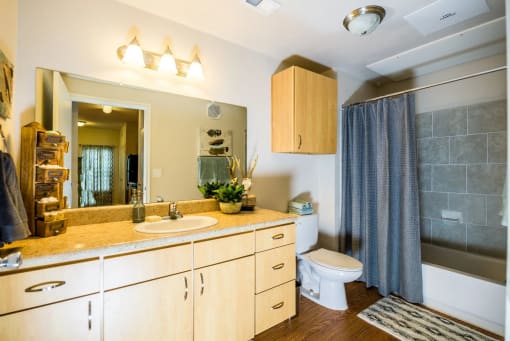 a bathroom with a sink toilet and shower at Villa Espada Apartments, San Antonio