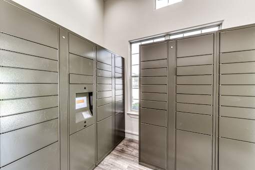 A row of stainless steel turnstiles with a card reader in the middle at Rosemary Apartments, Conroe, TX