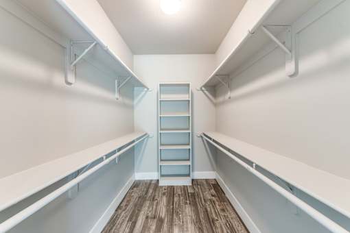 A long white shelf with a blue shelf in the middle at Rosemary Apartments, Texas, 77384