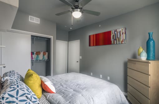 a bedroom with a large bed and a ceiling fan at Republic at Alamo Heights, San Antonio