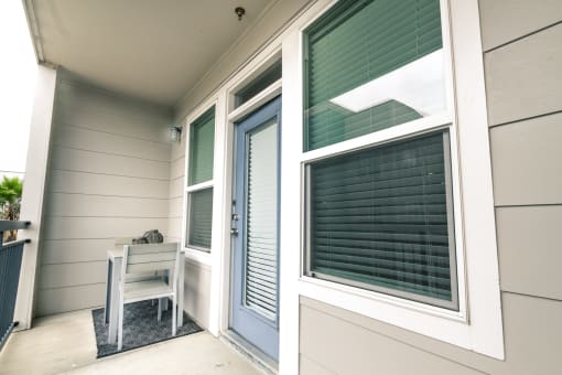 a small table on the porch of a manufactured home at Republic at Alamo Heights, San Antonio Texas