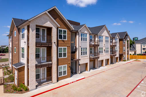 Modern apartment buildings with Reserved Resident Parking at Kessler, Fort Worth, TX