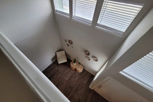 an overhead view of a room with a chair and a vase at Ivy Plains at Brooks Apartments, San Antonio , Texas