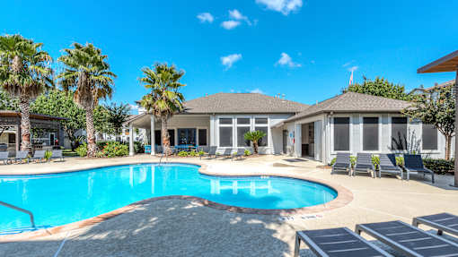 A large house with a pool in the backyard at Rosemary Apartments, Texas