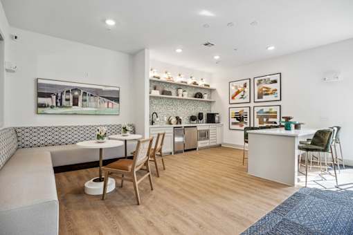 a living room with a kitchen and a dining area at Radius on Grove, Texas