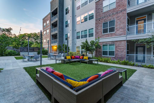 an outdoor lounge area at the bradley braddock road station apartments at Republic at Alamo Heights, San Antonio Texas