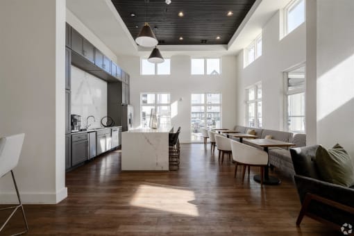 a large living room with a kitchen and a dining room at The Fitzroy San Marcos, San Marcos, TX