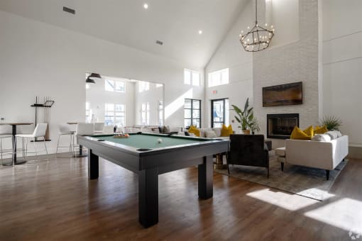 an open living room with a pool table at The Fitzroy San Marcos, San Marcos