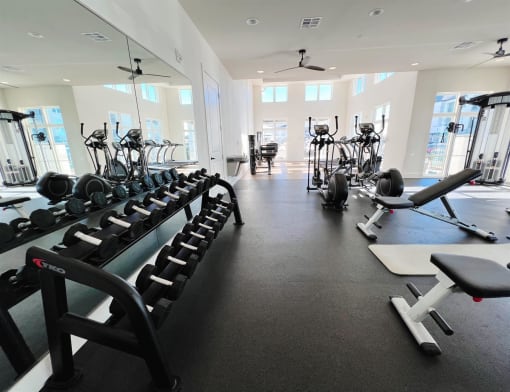 a fitness room filled with weights and cardio equipment at The Fitzroy San Marcos, San Marcos
