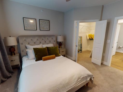 a bedroom with a large bed and a closet at The Fitzroy San Marcos, San Marcos, Texas