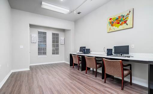 Business center with computer workstations at Houston Street Townhomes Apartments, San Antonio, TX