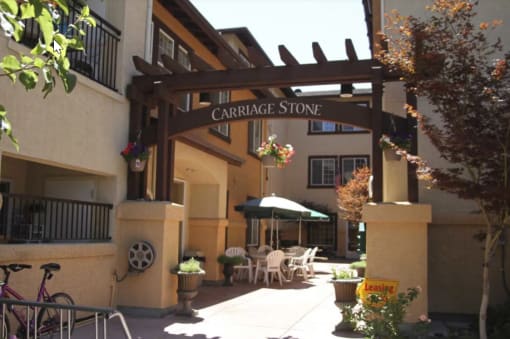 Sign and courtyard at Carriage Stone Senior