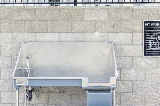 a stainless steel grill on the side of a building