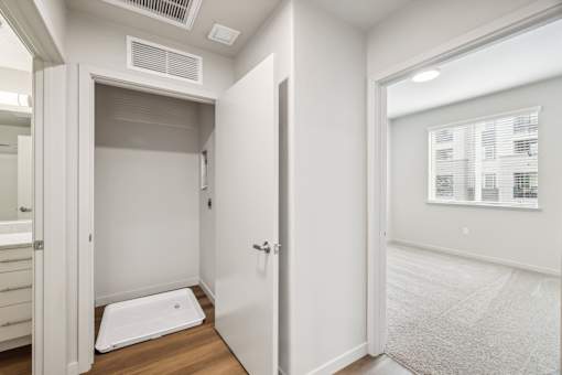 a bathroom with a shower and a door to a closet