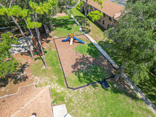 a park with a playground and a swing set