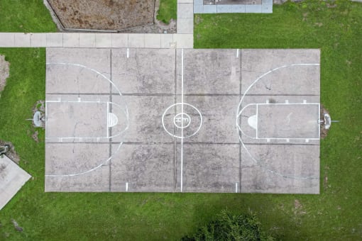 a birds eye view of a basketball court in a field