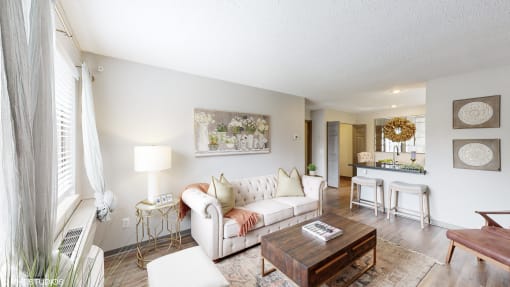 a living room with a couch and a table at Karric Place of Dublin Apartments, Dublin, OH, 43016