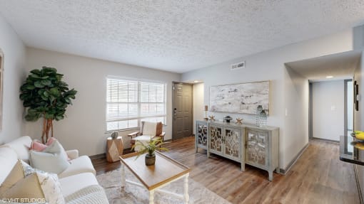 a living room with a couch and a table at Island Club Apartments, Columbus, OH, 43235