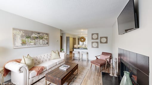 a living room with a couch and a coffee table at Karric Place of Dublin Apartments, Dublin, OH, 43016