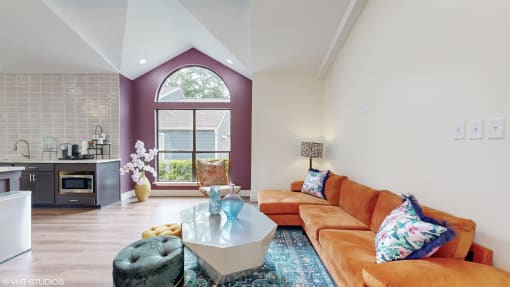 community clubroom with orange couch at The Vale Apartments and Townhomes, Tennessee, 38018