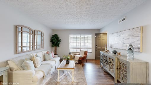 a living room with a couch and a table at Island Club Apartments, Columbus, OH, 43235