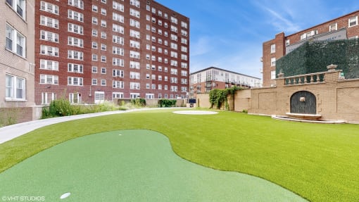 a putting green in the middle of a building at 275 on the Park Apartments, St. Louis, MO, 63108