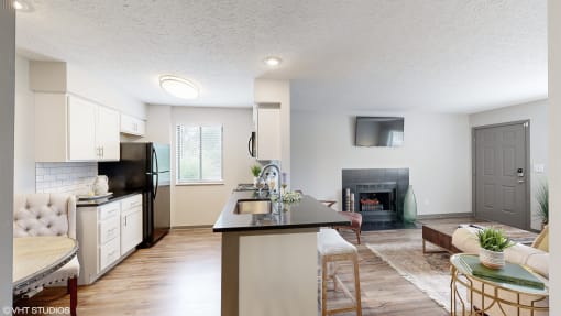an open kitchen and living room with a fireplace at Karric Place of Dublin Apartments, Ohio, 43016