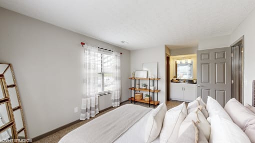 a living room with a couch, a bed and a kitchen at Island Club Apartments, Columbus, Ohio