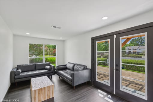 an office with two couches and a table