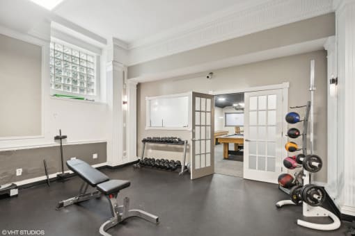 Gym with free weights and medicine balls  at The Embassy in St. Louis, 63108