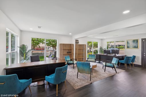 a living room with a table and chairs and a dining room