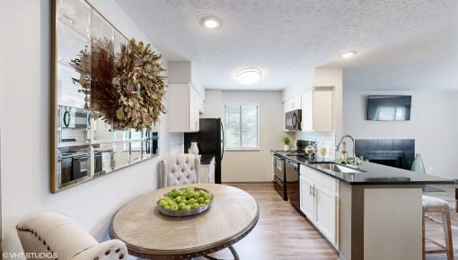 a kitchen and dining room with a table and chairs at Karric Place of Dublin Apartments, Dublin, 43016
