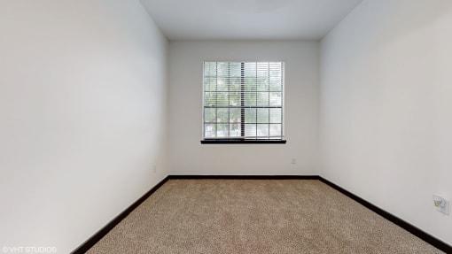 an empty room with a window and carpet at Bristol On Union Apartment Homes, Memphis, Tennessee