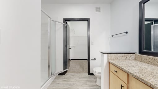 a bathroom with a shower and a sink and a toilet at Bristol On Union Apartment Homes, Memphis