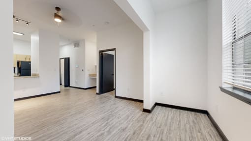 living room with sunroom and wood flooring at Bristol On Union Apartment Homes, Memphis, TN