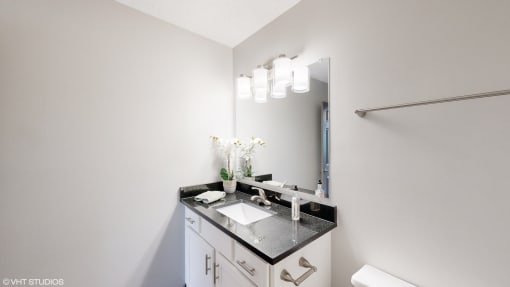 a bathroom with a sink and a mirror at Karric Place of Dublin Apartments, Ohio, 43016