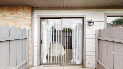 the front door of a home with a white gate and a wedding dress on it at Karric Place of Dublin Apartments, Dublin