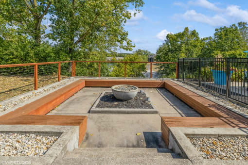 a backyard with a fire pit and a fence at Runaway Bay Apartments, Columbus, OH, 43204