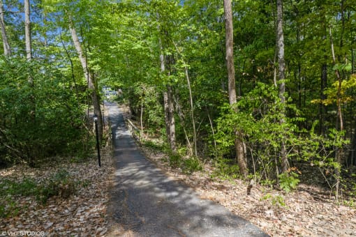 a path through the woods on the trail at Silvertree at Little Turtle Apartments, Westerville, 43081