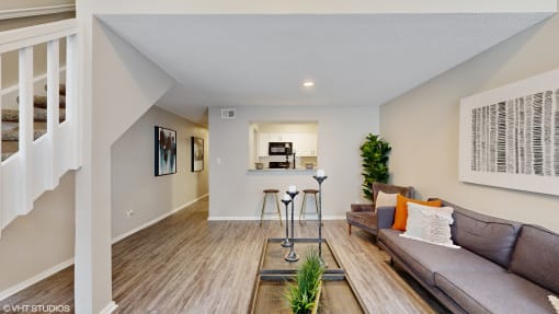 a living room with a couch and a table at The Vale Apartments and Townhomes, Tennessee, 38018