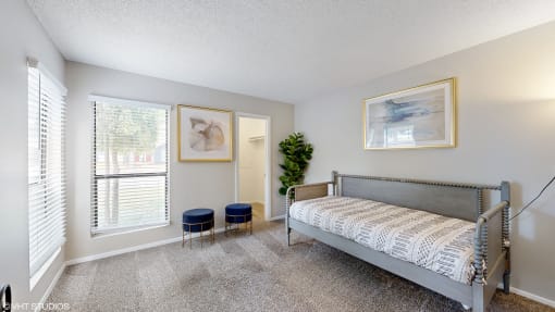 a bedroom with a bed and a window at The Vale Apartments and Townhomes, Tennessee