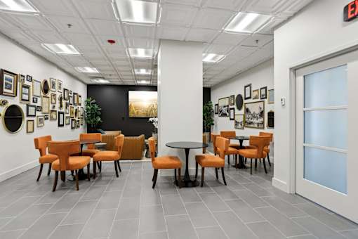 A room with a white ceiling and a black wall with a white door.