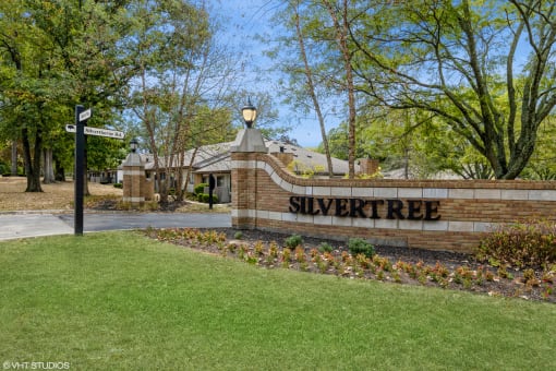 the entrance to the silver tree neighborhood sign in front of a building at Silvertree at Little Turtle Apartments, Westerville, OH, 43081