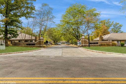 a street in a neighborhood with houses and trees at Silvertree at Little Turtle Apartments, Westerville