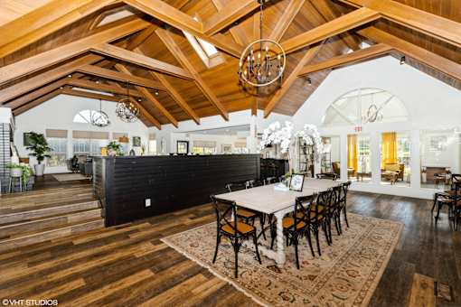 A dining room with a wooden table and chairs at Island Club Apartments, Ohio, 43235