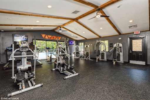 A gym with a variety of equipment including treadmills, weights, and exercise machines at Karric Place of Dublin Apartments, Dublin